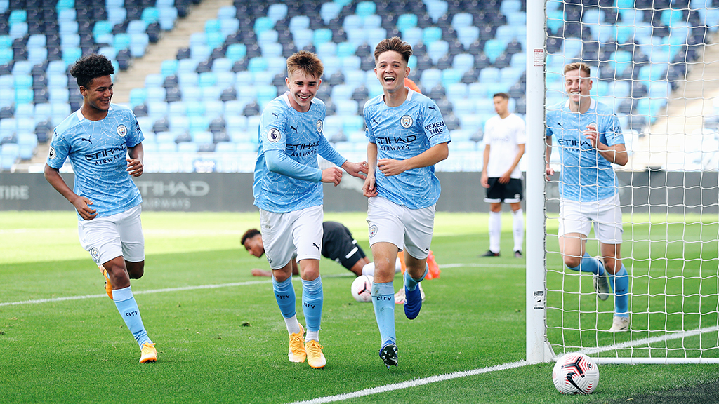 ALL SMILES: James McAtee and Co celebrate after his opener for City