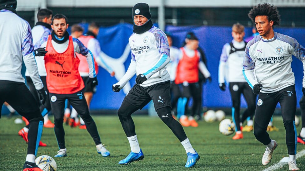 THREE CHEERS : Bernardo Silva, Gabriel Jesus and Leroy Sane limber up in Tuesday's training session