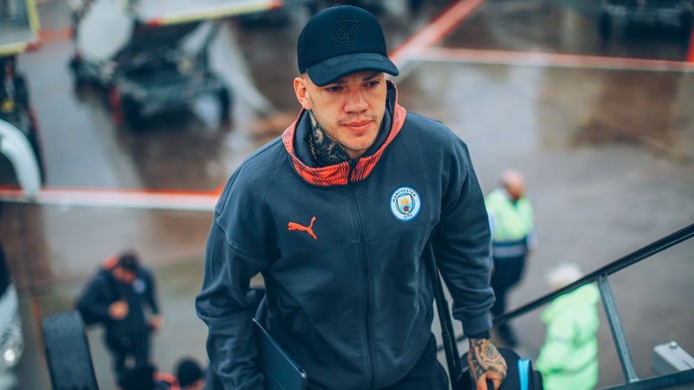 CAP THAT : Ederson sported a neat looking baseball cap as he boarded the aircraft