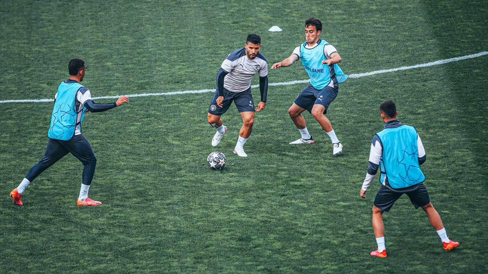 MAN IN THE MIDDLE : Aguero looks to wriggle free under pressure.