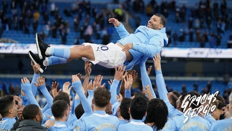 MAIN MAN: The players lift Aguero up into the air!