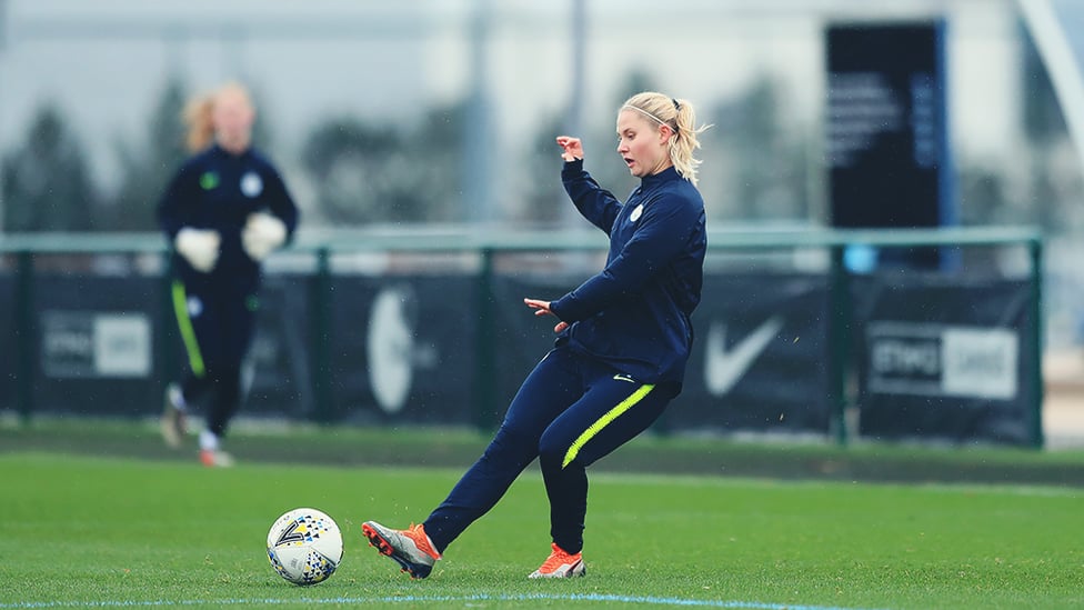 CROSS PURPOSES : City and Denmark defender Mie Jans drills in the ball