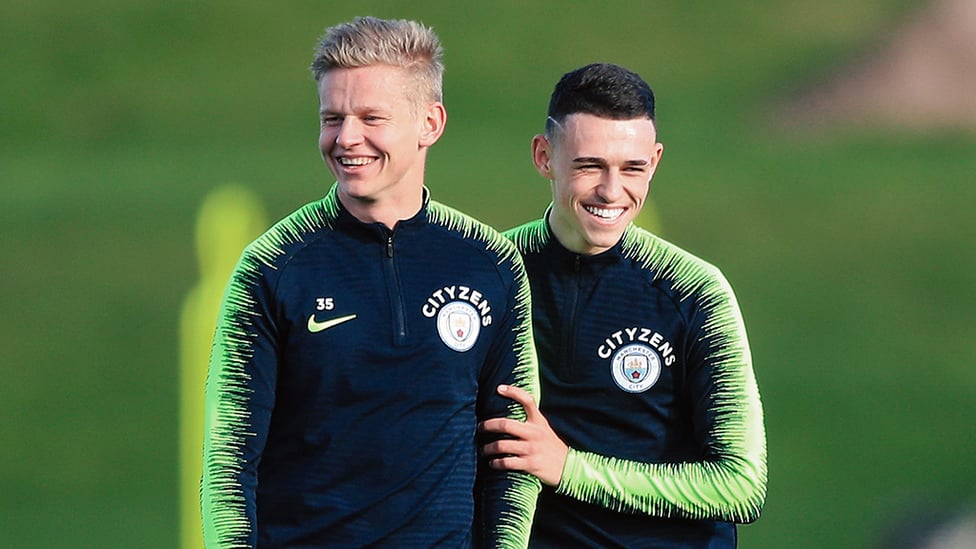 YOUNG AT HEART : Something has tickled Oleksandr Zinchenko and Phil Foden's fancy!