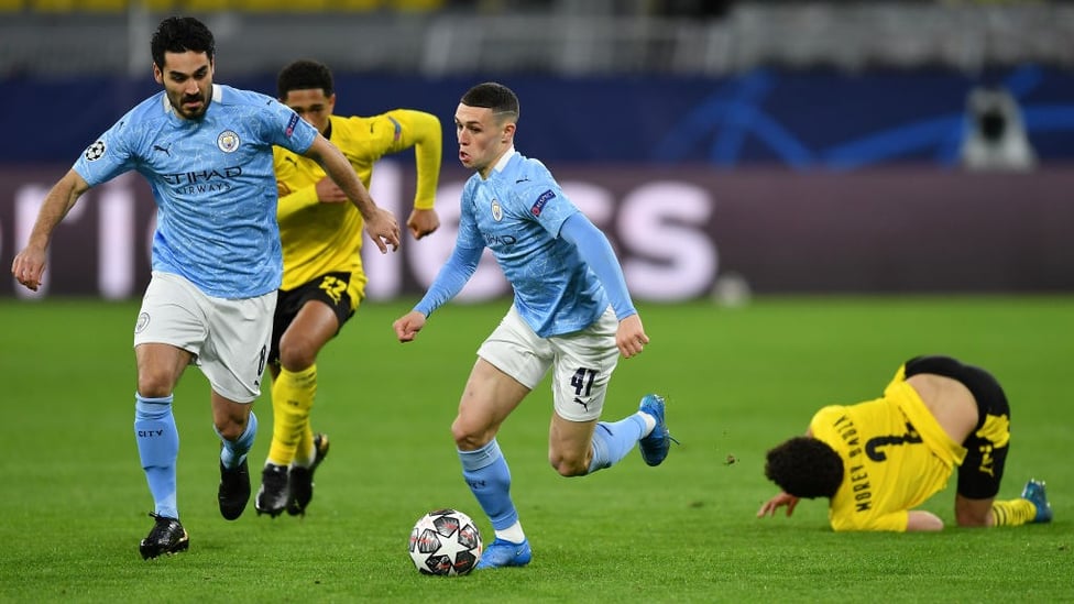FLYING PHIL: Phil Foden leaves the Dortmund midfield in his wake