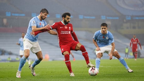 DOUBLE TROUBLE: Ruben Dias and Rodrigo put on the press against Mo Salah