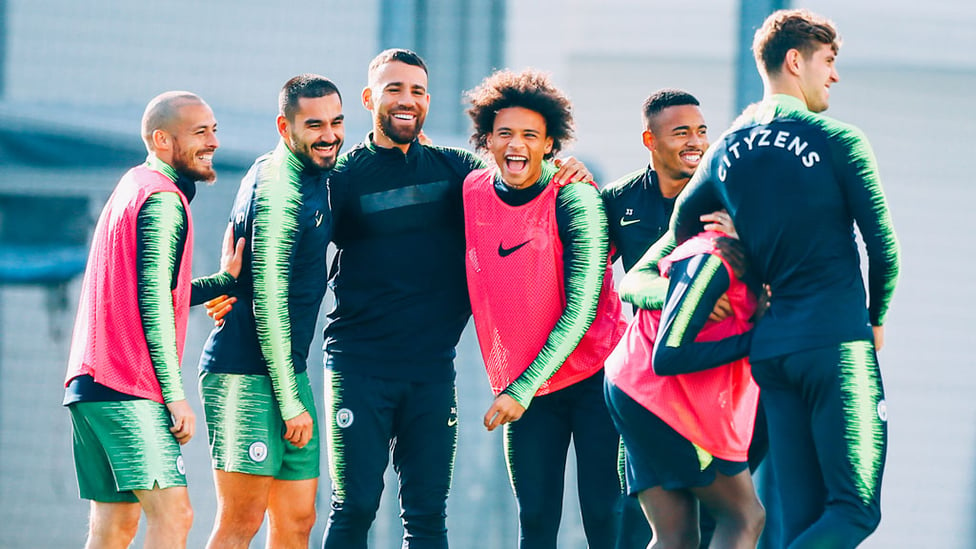 FEELING GOOD : The squad smile in the Manchester sun