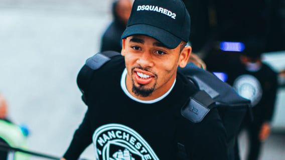 BRAZILIAN BLEND: Gabriel Jesus was in great spirits as he boarded the plane at Manchester Airport