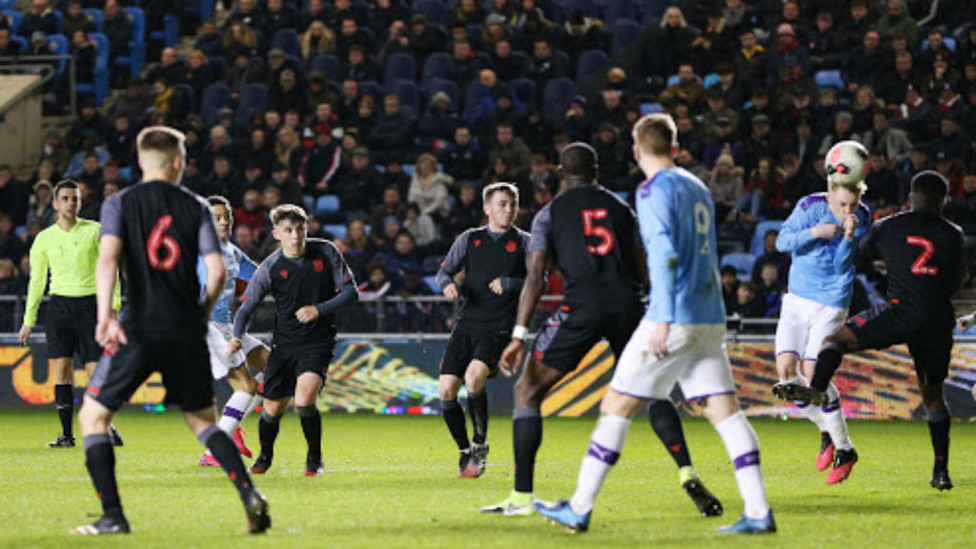 GET IN: Sam Edozie's shot is deflected by Cole Palmer to give City the lead