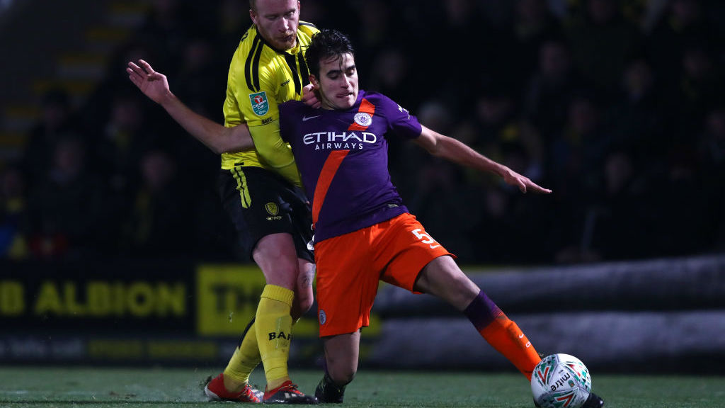 CLEARING THE DANGER : Eric Garcia stops a Burton attack with a timely interception
