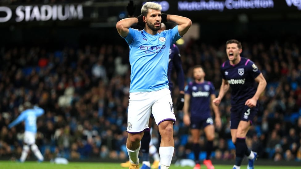 CLOSE : Aguero reacts as his shot goes just wide of the post.