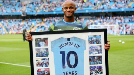 PERFECT 10: Vincent Kompany was presented with a special framed shirt to mark his decade at City prior to last Saturday's match against Newcastle