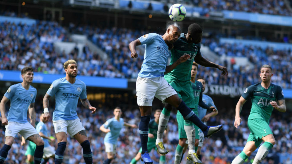 HIGH AND MIGHTY : Fernandinho clears the danger as Spurs attack