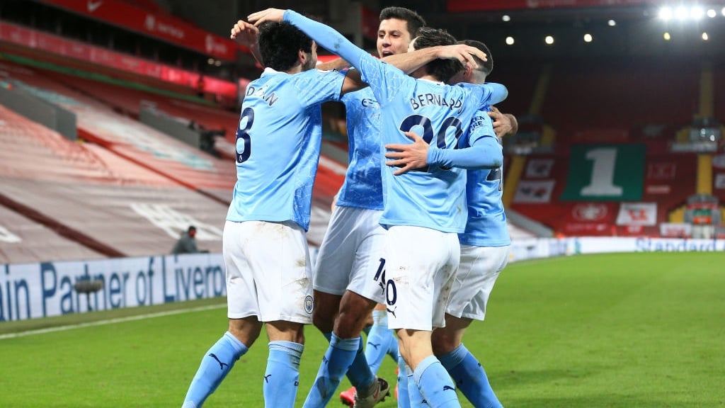 GROUP HUG: The players gather to celebrate going back ahead at Anfield!