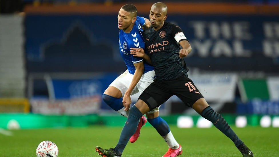 BRAZILIAN BATTLE : Fernandinho goes shoulder-to-shoulder with his international counterpart, Richarlison.