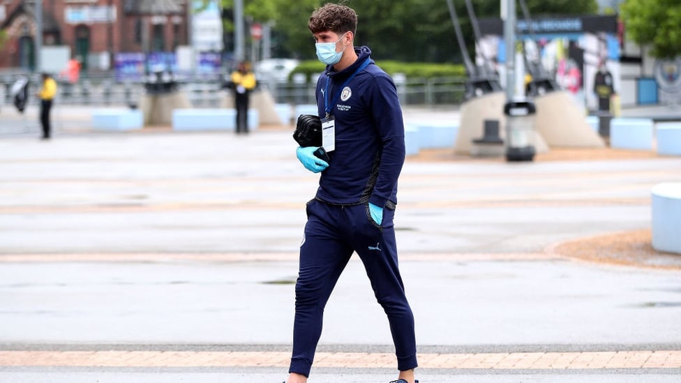 ARRIVAL : Stones makes his way into the Etihad Stadium and is named in the starting lineup.