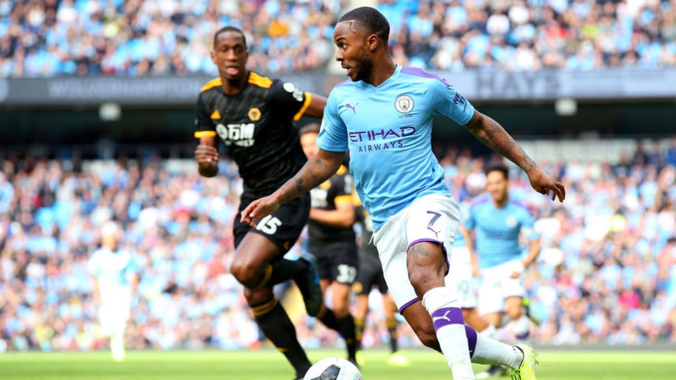 DRIBBLE : Sterling looks to unlock a rigid Wolves defence.