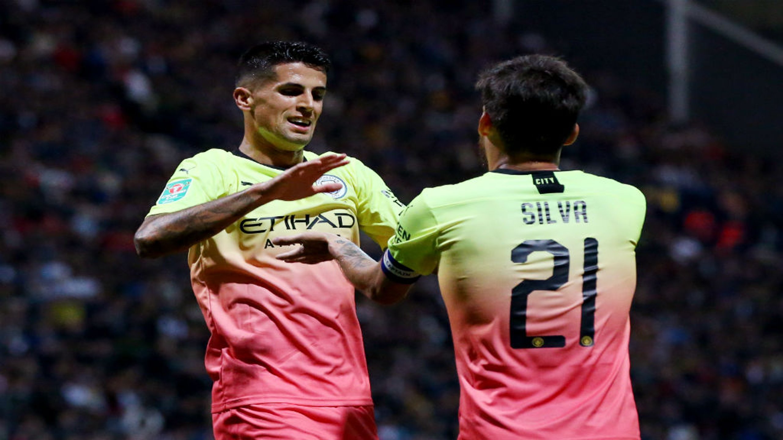 CAPTAIN FANTASTIC: Joao Cancelo celebrates with skipper David Silva, who orchestrated our third goal 