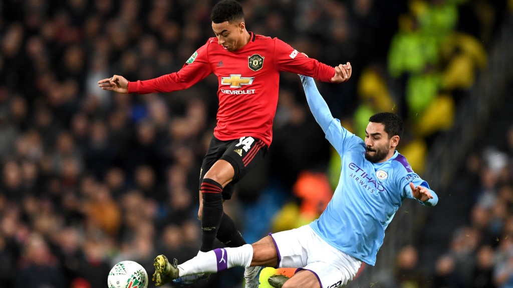 SILKY ILKAY: Gundogan wins the ball back fairly from Lingard.