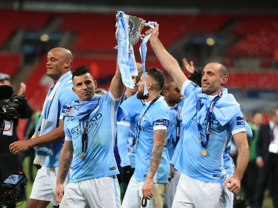 GET IN : Aguero celebrates the Capital One Cup win with Pablo Zabaleta