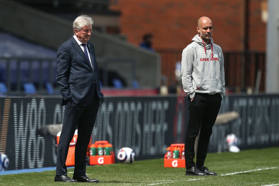 THE BOSSES : Roy Hodgson and Pep Guardiola watch on from the dugout