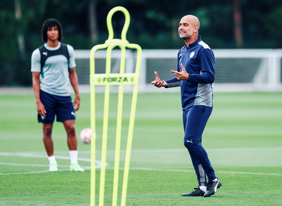 PEP TALK: The boss makes a few pointers as Nathan Ake looks on