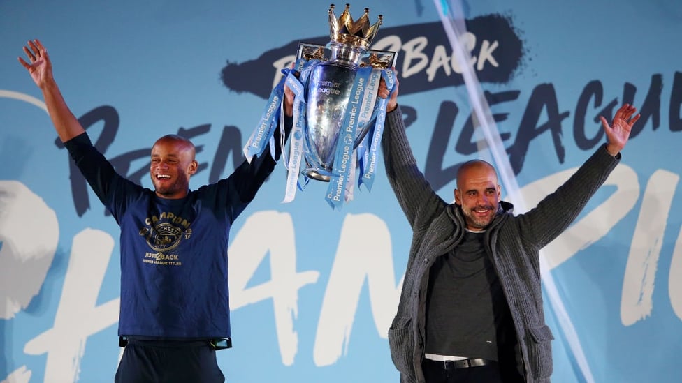 FOR EVERY OCCASION : The boss lifts the Premier League trophy... in his cardigan