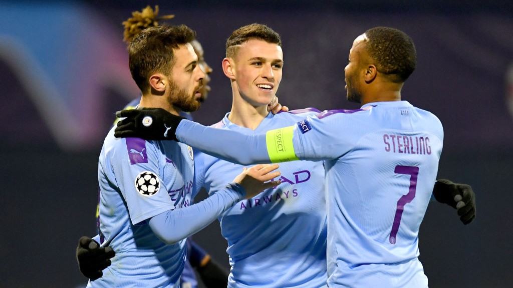 GROUP HUG : Phil Foden celebrates City's fourth.