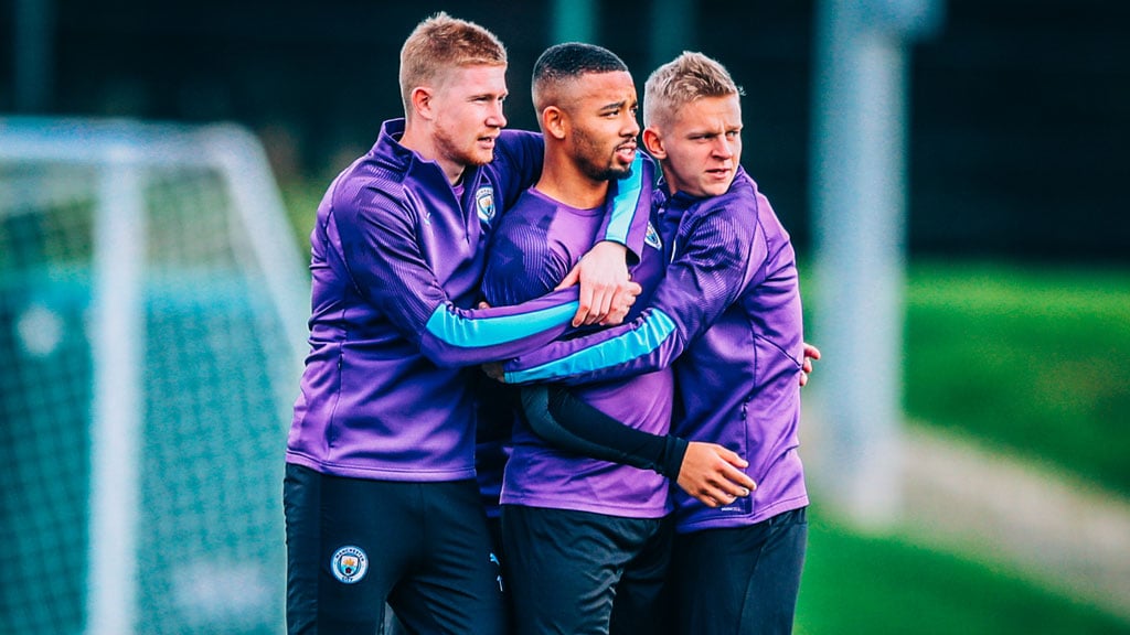 GROUP HUG: Kevin De Bruyne, Gabriel Jesus and Oleksandr Zinchenko huddle up.