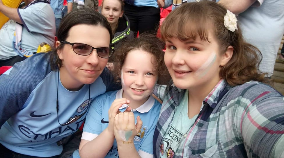 MAGGS AND AERYN KELLY : "What does Manchester City women mean to us? It means: family ,pride and passion  The OSC put on coaches for away games which makes it easier for me to bring Aeryn with me. Aeryn has been a mascot twice. I’m looking forward to the future at City - more trophies! I can definitely see us winning the Champions League. Hopefully, we will be back in our seats watching the team live, meeting up with our football family."