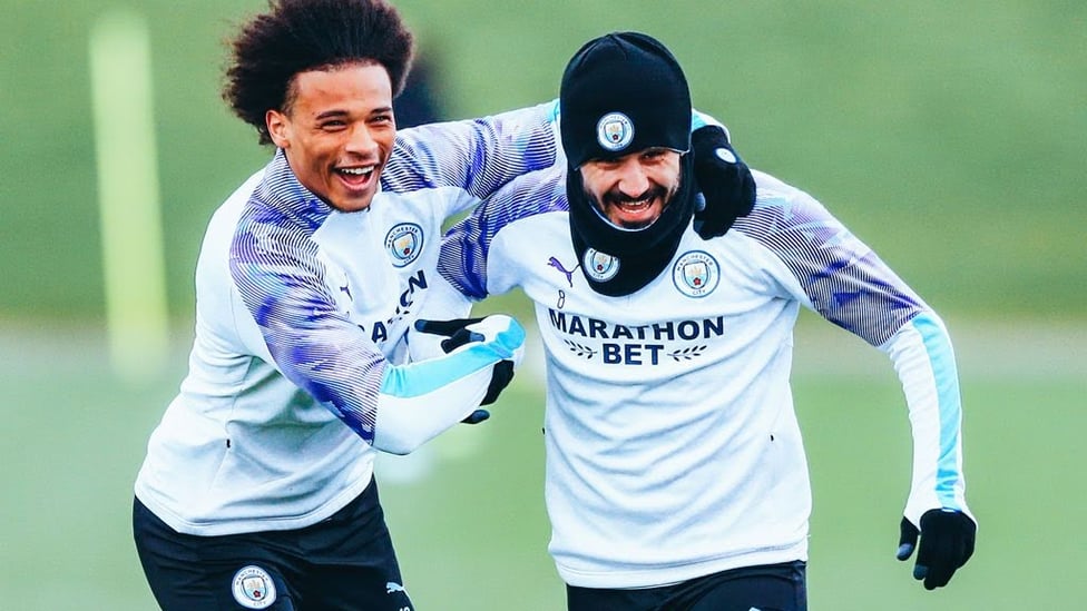 BLUES BROTHERS: Leroy stepped up his comeback by returning to full training at the end of January - and here he shares in some fun with Ilkay Gundogan