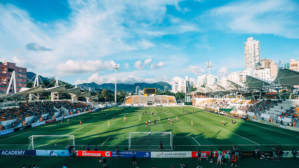 SUNSHINE BOYS : Sunlight bathes the scene at City's open training session in Hong Kong