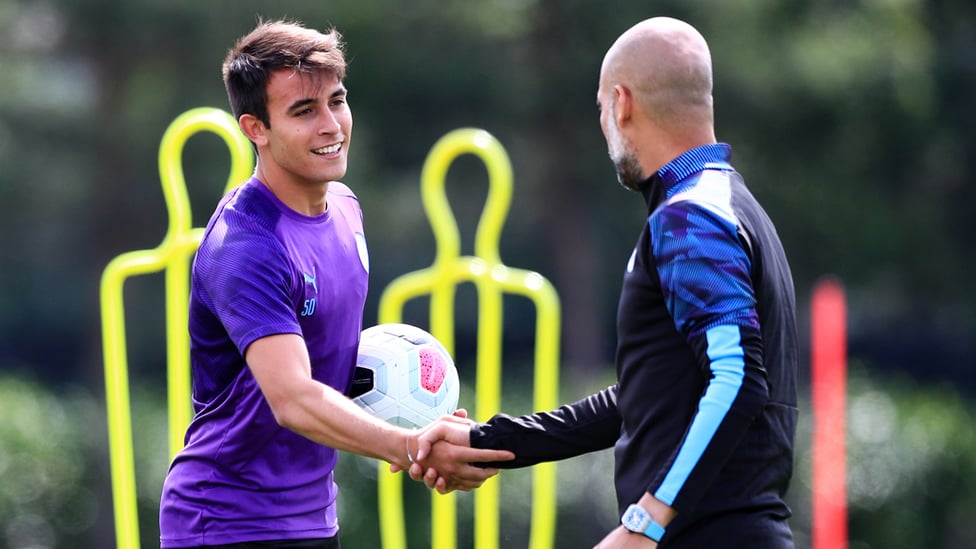 WELCOME BACK : Pep Guardiola greets youngster Eric Garcia