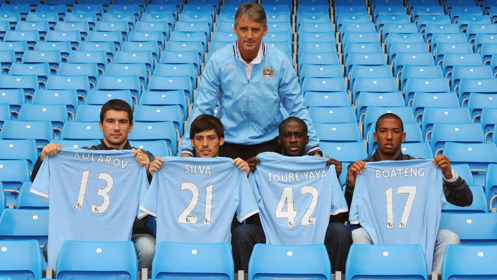 DONE DEAL : David Silva first signed for City back in the Summer of 2010, here is he pictured with fellow signings Aleksandar Kolarov, Yaya Toure and Jerome Boateng and former boss Roberto Mancini.