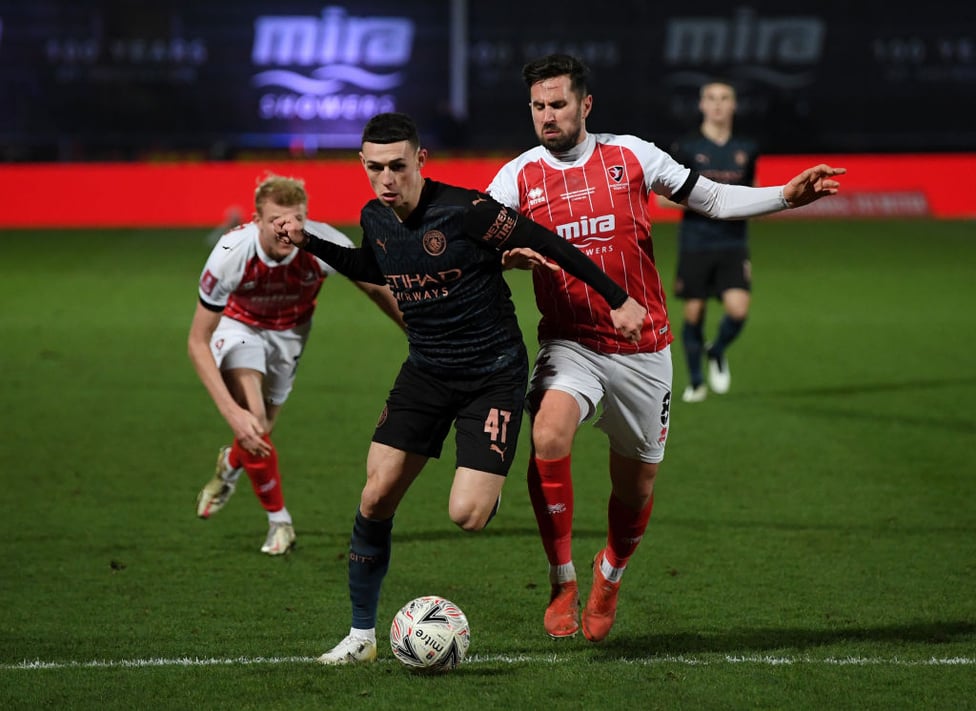 ON THE HUNT : Phil Foden tries his best to break down Cheltenham's defence