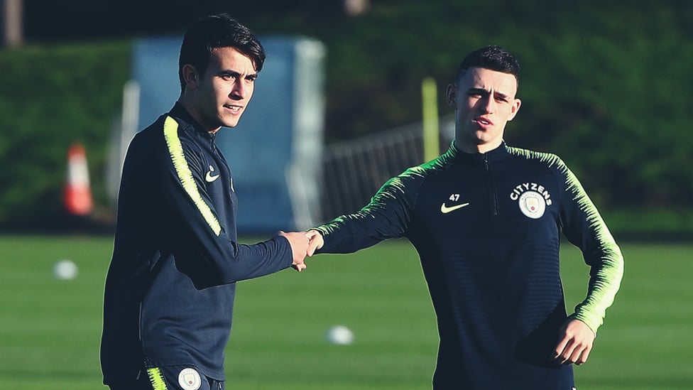 YOUNG STARS : Eric Garcia gives Phil Foden a helping hand