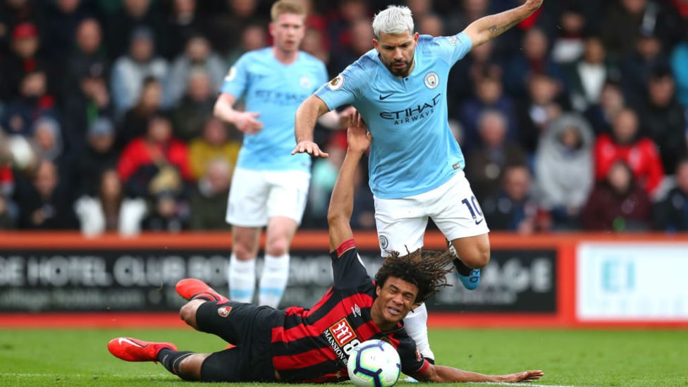 ACTION STATIONS : Nathan Ake goes crashing as he fends off Sergio Aguero