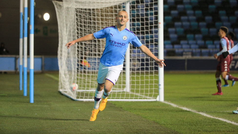 STRIKE ONE : Lewis Fiorini wheels away in celebration after his opening goal