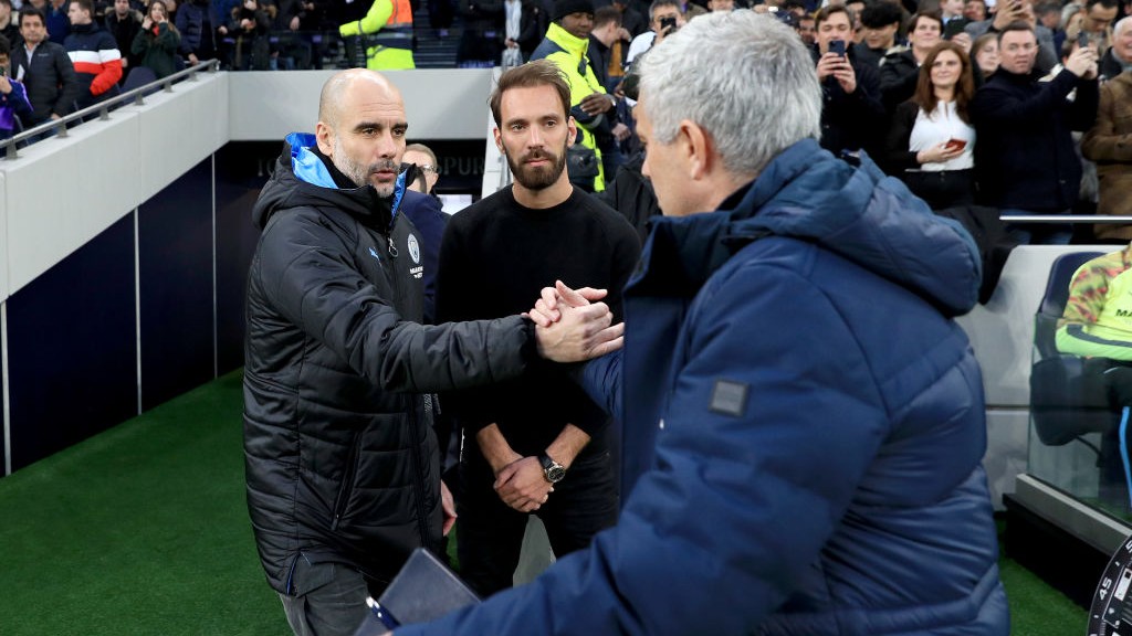 GAFFERS: Guardiola and Mourinho share a handshake ahead of kick-off.