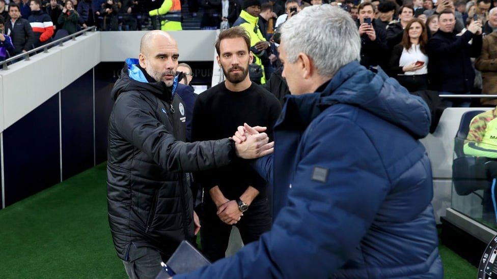 GAFFERS : Guardiola and Mourinho share a handshake ahead of kick-off.