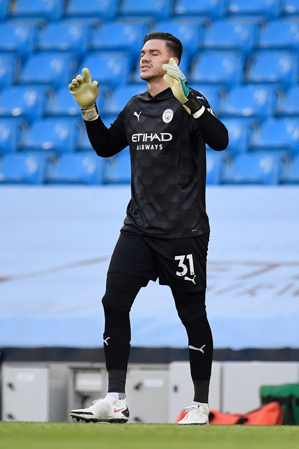 SAFE HANDS : Ederson says his final prayers ahead of kick-off.