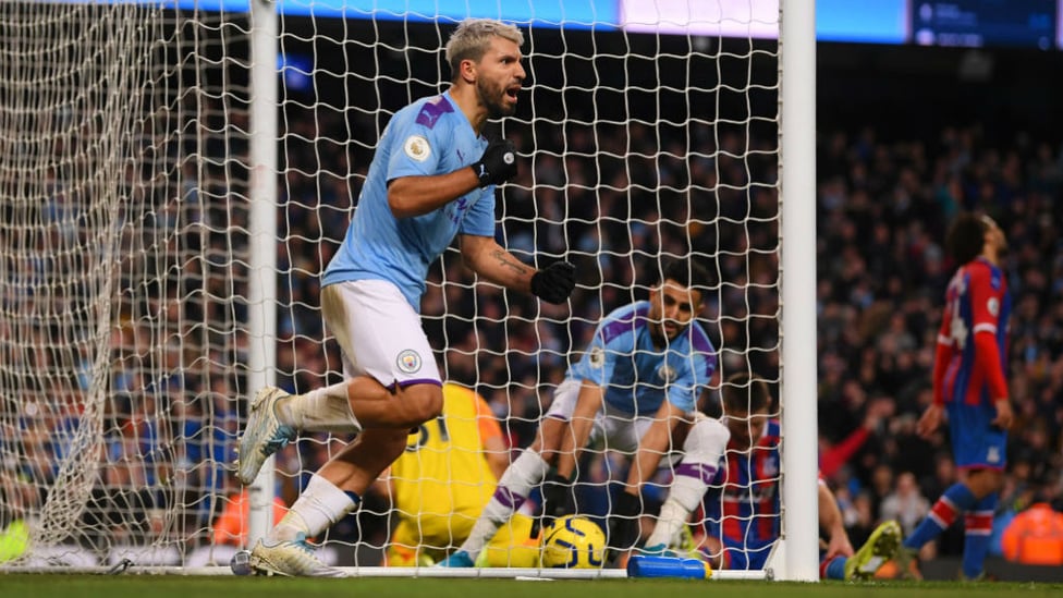 HISTORY MAKER : Aguero wheels away to celebrate his 250th City goal.