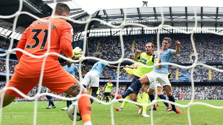 CONSOLATION: Jon Stankovic pulls a goal back for the visitors, sweeping in Steve Mounie's knock-on