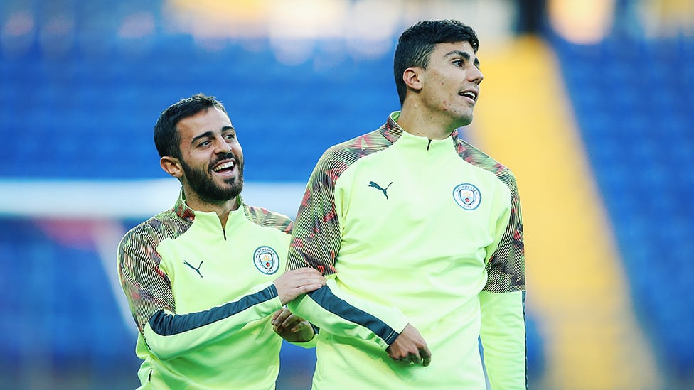 TWO'S COMPANY : Bernardo Silva and Rodrigo limber up ahead of tomorrow's Shakhtar clash