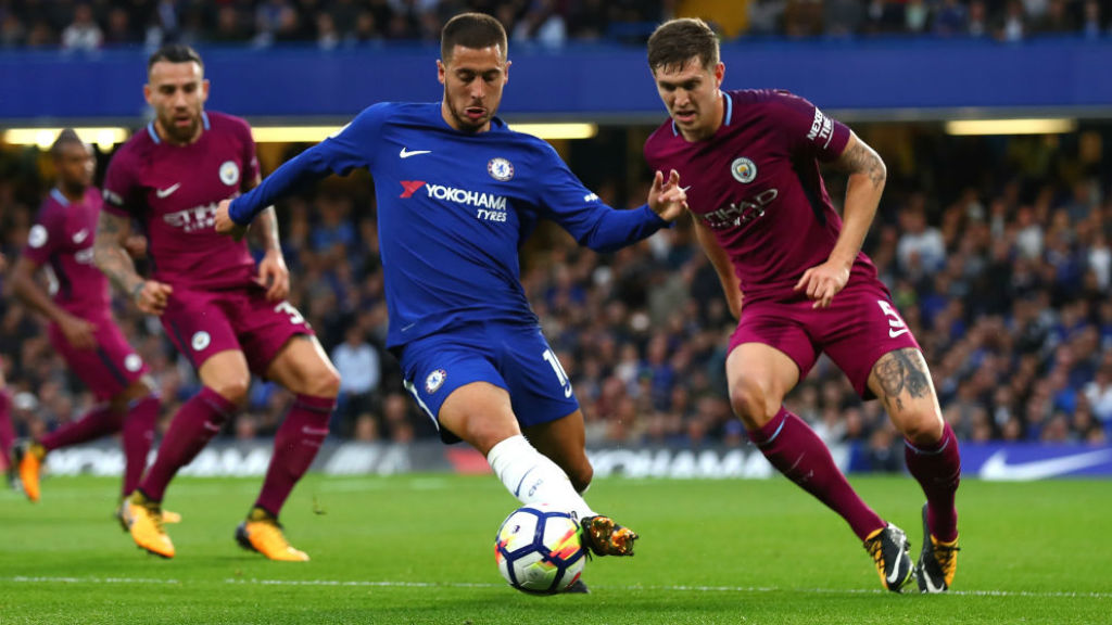 NO ENTRY : John Stones keeps a watchful eye on Eden Hazard