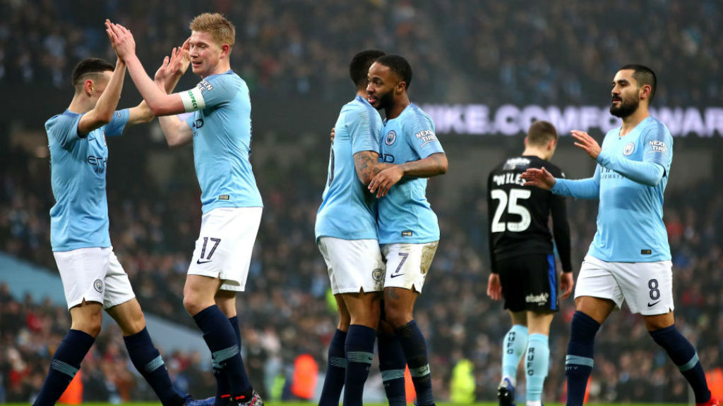 CELEBRATION TIME: The Blues are all smiles after Raheem Sterling's early strike