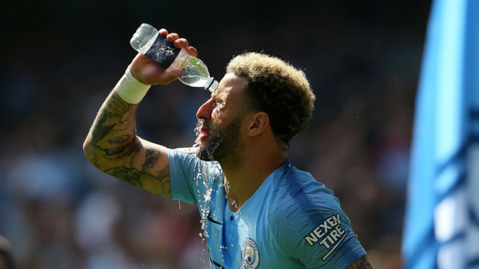 WATER BREAK : Kyle Walker cools off in the blazing Easter sunshine