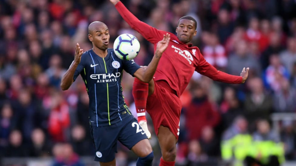 MIDDLE MARCH : Fernandinho battles with Georgino Wijnaldum