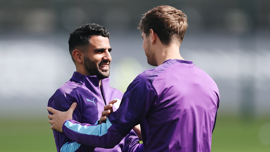 WELCOME BACK: John Stones greets the returning Riyad Mahrez.