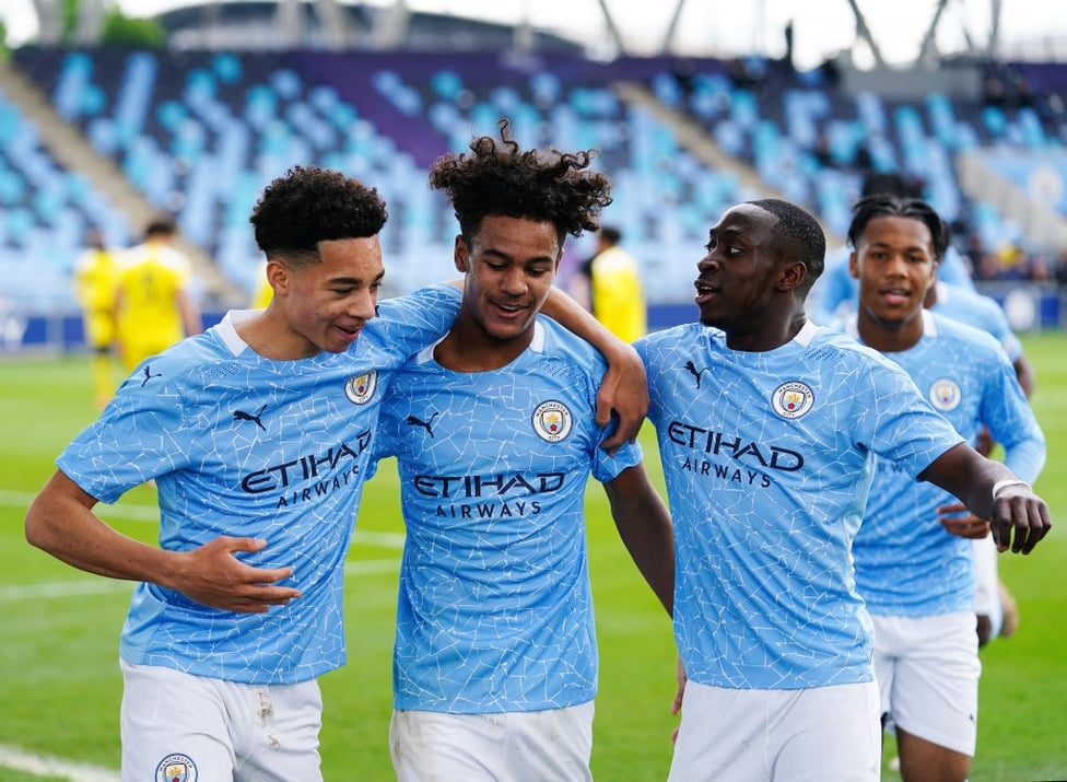 THREE CHEERS: Goalscorers Sam Edozie, Oscar Bobb and Carlos Borges get the party started against Fulham