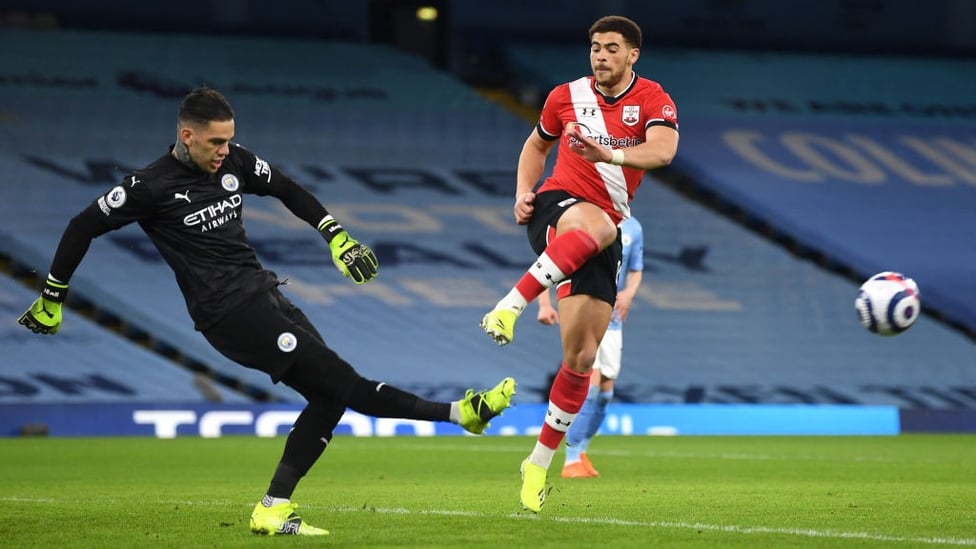 BETWEEN THE STICKS: Ederson clears his lines under the attentions of Che Adams